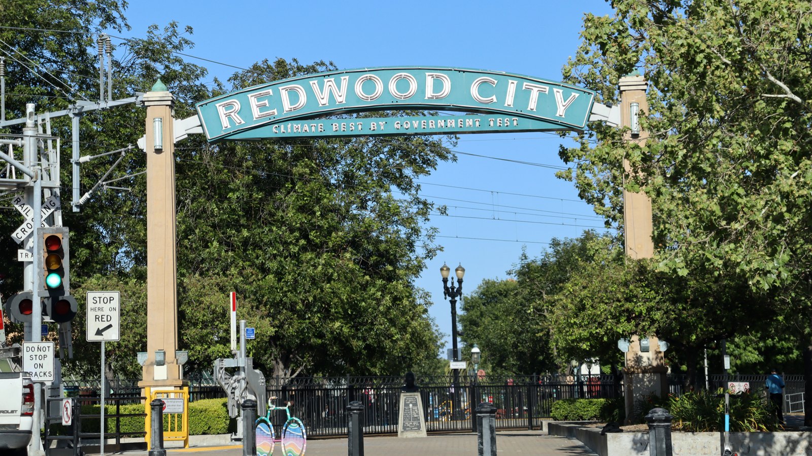 The Redwood City arch over Broadway, reading Climate Best By Government Test