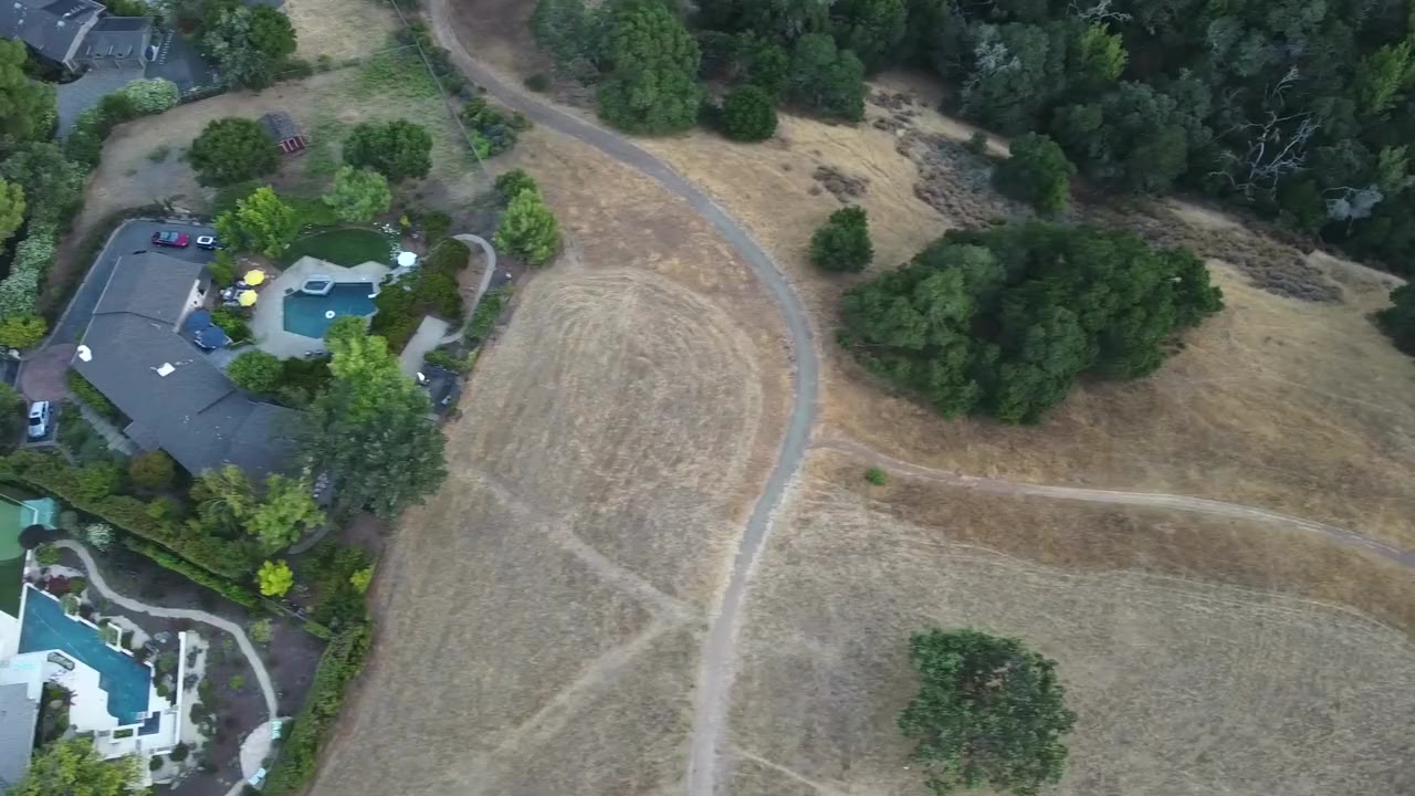 Homes and pools among the oaks in the Bay Area hills